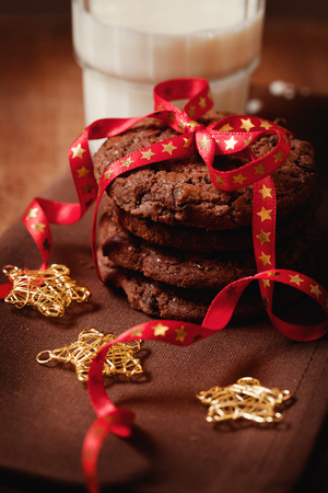 Christmas chocolate cookies tied with the ribbonの写真素材