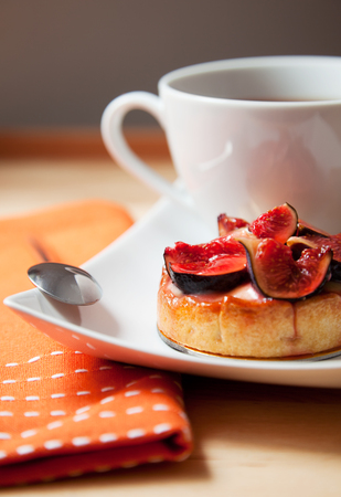 Fig cake with a cup of teaの写真素材