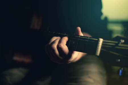  Close-up of men playing acoustic guitarの写真素材