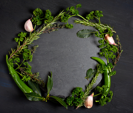 Fresh ingredients for healthy cooking on black stone slate board, top view, banner. Diet or vegetarian food conceptの写真素材