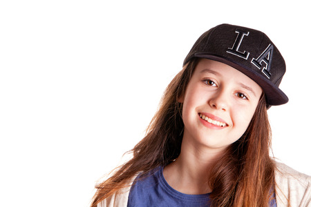 Portrait of the young stylish girl over the white backgroundの写真素材