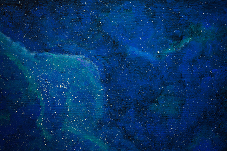 Painted galaxy over the wooden backgroundの写真素材