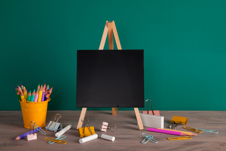 Back to school concept with school supplies. Colorful pencils and Blackboard with copy spaceの写真素材