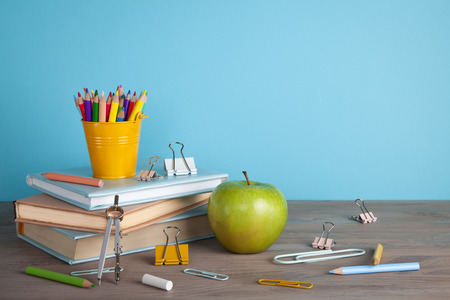 Back to school concept with school supplies. Colorful pencils, books with copy spaceの写真素材