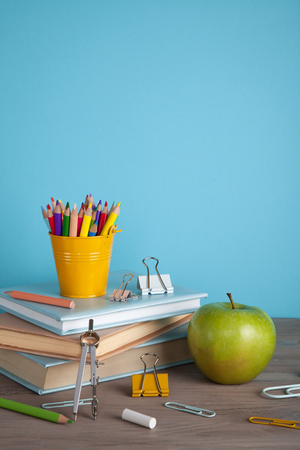 Back to school concept with school supplies. Colorful pencils, books with copy spaceの写真素材