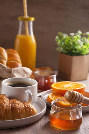 Breakfast with coffee, orange juice and croissant.の写真素材