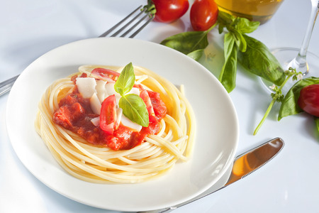 Spaghetti with tomato sauce and parmesanの写真素材
