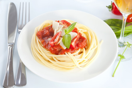 Spaghetti with tomato sauce and parmesanの写真素材