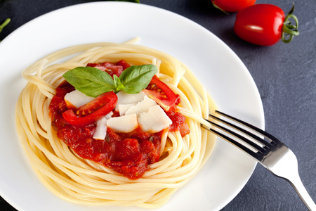 Spaghetti with tomato sauce and parmesanの写真素材