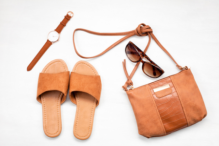 Summer street style. Fashion summer girl clothes set, accessories. Trendy sunglasses, shoes, top, handbag clutch, necklace hat,flowers. Summer lady. Creative urban overhead summer top viewの写真素材