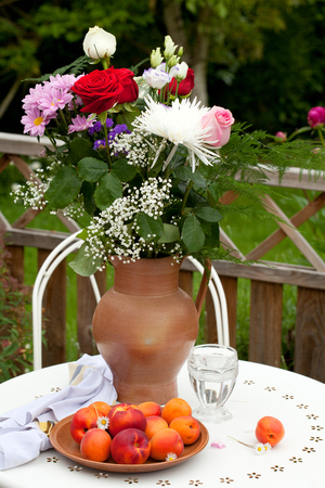 Fresh fruits and flowers in the terraceの写真素材