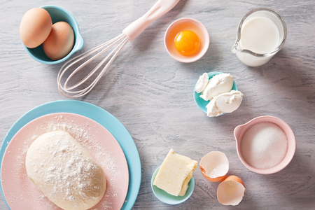 Baking ingredients flat lay on wooden background with copy space. Top viewの写真素材