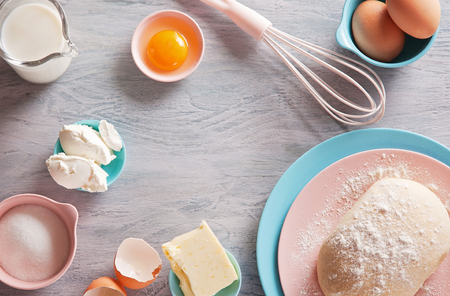Baking ingredients flat lay on wooden background with copy space. Top viewの写真素材