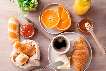 Breakfast with coffee, orange juice and croissant. Top viewの写真素材