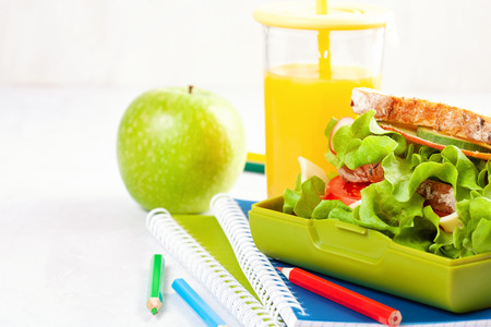 Fresh sandwich and apple for healthy lunch in the plastic lunch boxの写真素材