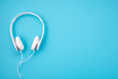 White earphones on blue backgroundの写真素材