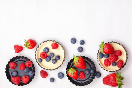 Sweet pastry with berries baking. Top view, mockup for recipe, culinary classes, cooking blog.の写真素材