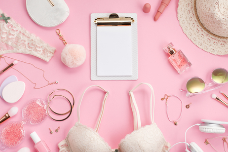 Girls morning ritual concept. Summer style in pink pastel colors. Lace lingerie, cosmetics and accessoriesの写真素材