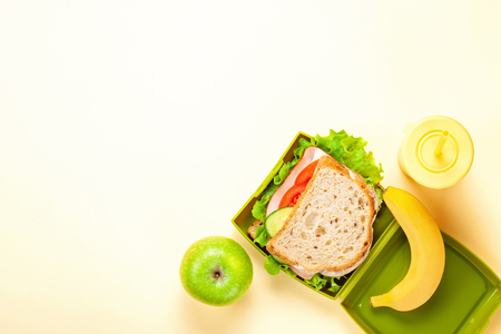 Fresh sandwich and apple for healthy lunch in the plastic lunch boxの写真素材