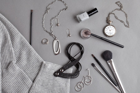 Flat lay with female accessories in gray shadesの写真素材