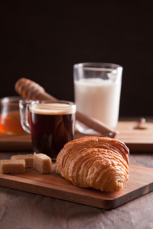 Breakfast with hot expresso and fresh croissantの写真素材