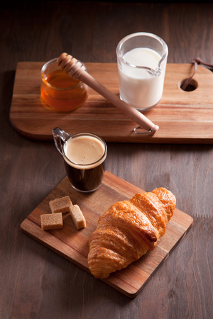 Breakfast with hot expresso and fresh croissantの写真素材
