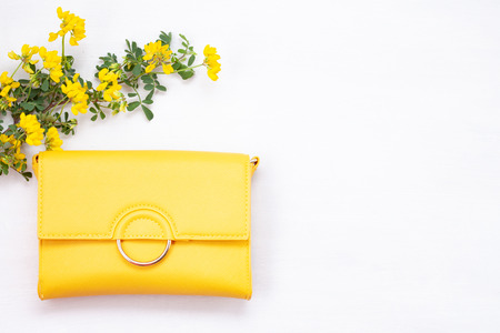 Bright yellow woman's handbag. Summer style accessoriesの写真素材