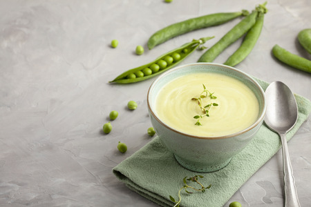 Fresh vegetable soup made of green peas. Homemade healthy diet concept suitable for vegans and vegetariansの写真素材
