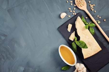 Parmesan cheese, olive oil, basil, garlic , pine nuts - fresh ingredients for pesto cooking recipe. Italian kitchen conceptの写真素材