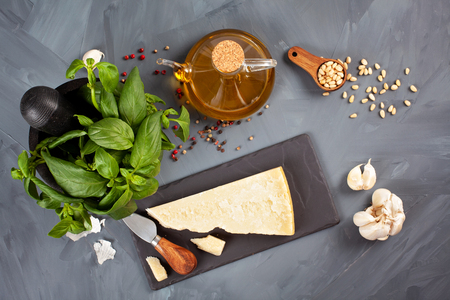 Parmesan cheese, olive oil, basil, garlic , pine nuts - fresh ingredients for pesto cooking recipe. Italian kitchen conceptの写真素材