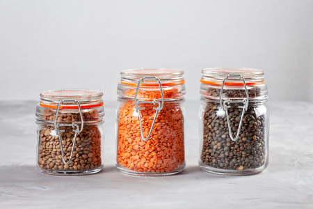 Red, white and green lentils rich source of fiber and protein. Healthy food concept. Vegan, vegeterian balanced dietの写真素材