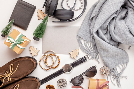 Flat lay of men's accessories with shoes, watch, phone, earphones, sunglasses, scarf over the orange background. Sales, Shopping, gift ideas. Top viewの写真素材