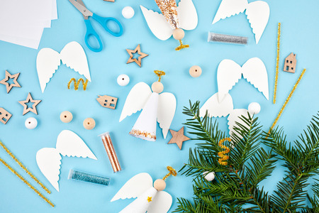 Creative hobby. DIY Christmas greeting cards and decoration. Process of making handmade christmas paper angelsの写真素材