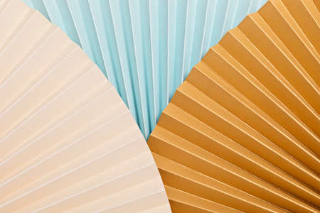 Abstract background with textured paper fans. Festive celebration backdrop. Mockup for product...