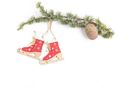 Copy space with Christmas tree branch,  organic wooden ornaments and pine cone on white background, flat lay, top viewの写真素材