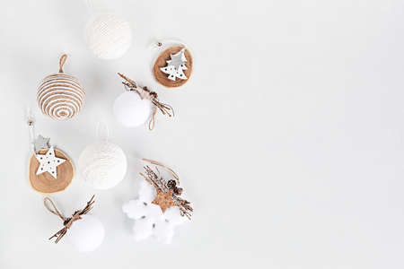 Assortment of Scandinavian style, cozy eco friendly, Handmade Christmas ornaments on light background, flat lay, top view with copy spaceの写真素材