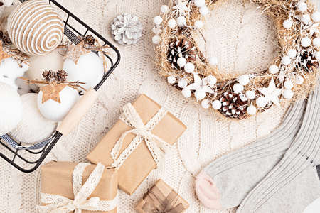 Assortment of Scandinavian style, cozy eco friendly, Handmade Christmas ornaments and gifts on light background, flat lay, top view with copy spaceの写真素材