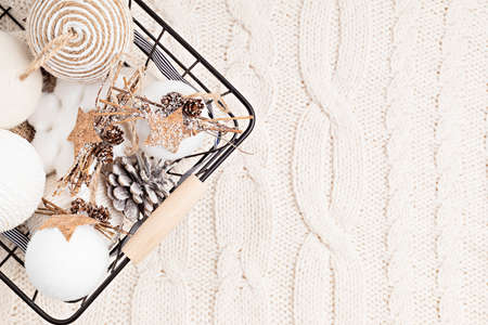 Assortment of Scandinavian style, cozy eco friendly, Handmade Christmas ornaments on light knitted...
