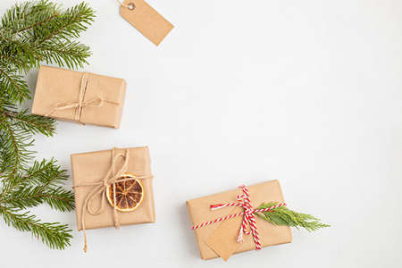 Eco friendly alternative green Xmas gifts wrapped with recycled craft paper. Zero waste Christmas,...