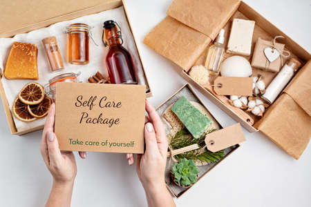 Preparing self care package, seasonal gift box with plastic free zero waste cosmetics products. Personalized eco friendly basket for family and friends for thankgiving, christmas, mothers dayの写真素材