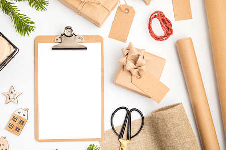 Eco friendly alternative green Xmas gifts wrapped with recycled craft paper. Zero waste Christmas, flat lay, top viewの写真素材