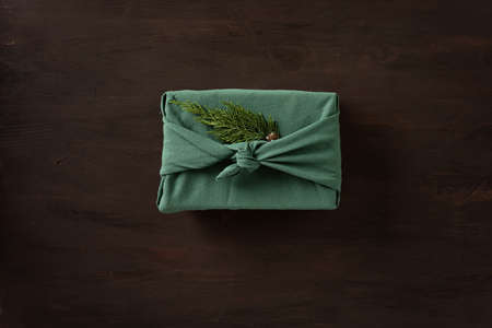 Furoshiki gifts. Eco friendly alternative green Xmas presents wrapped in clothes. Japanise tradition. Zero waste Christmas, flat lay, top viewの写真素材