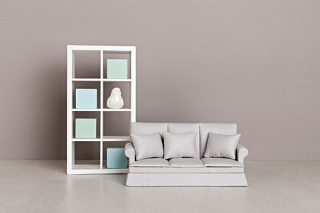 Stylish minimal living room interior of modern apartment with trendy elegant furniture, sofa and bookcase. Interior design mockupの写真素材