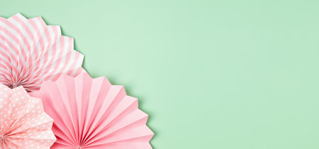 Festive party banner background with pink paper circle fans over pastel background. Festival,...