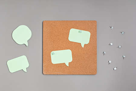 Cork board with pinned memo notes mockupの写真素材