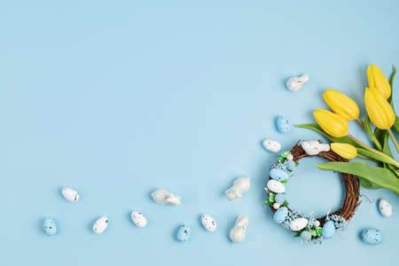 Handmade diy home interior decoration wreath with colorful easter eggs and tulipsの写真素材