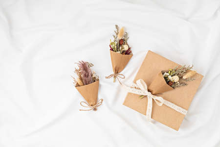 Gift boxes in craft paper and natural decorations, creative and recyclable holidays present wrappingの写真素材