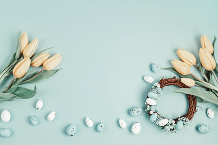 Handmade diy home interior decoration wreath with colorful easter eggs and tulips