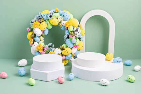 Podium, stand for product presentation and easter wreath with eggs. Mockup