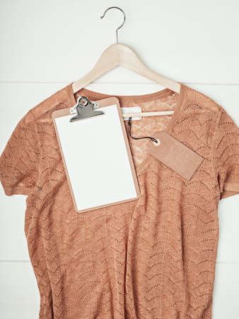 Second hand shop concept. Top view over pullover with tag mockup
